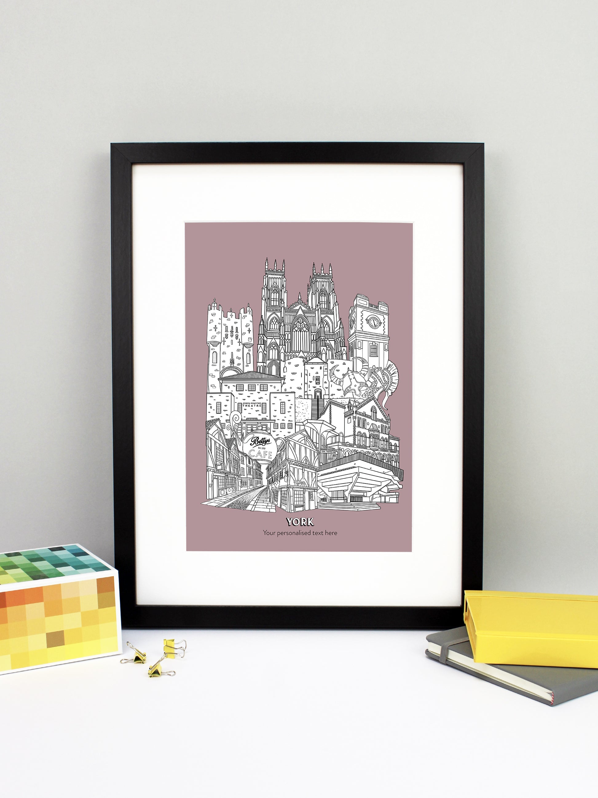 Beautifully detailed York Illustration print. The perfect gift for an engagement, wedding, birthday, anniversary and house warming. It features all the well known buildings and landmarks from the historical UK city. The buildings featured are: Bettys Tea Shop, Central Hall University, Joseph Rowntree Theatre, Micklegate Bar, Terrys Clock Tower, The Sambles, Clifford's Tower, York Theatre Royal and York Minster.